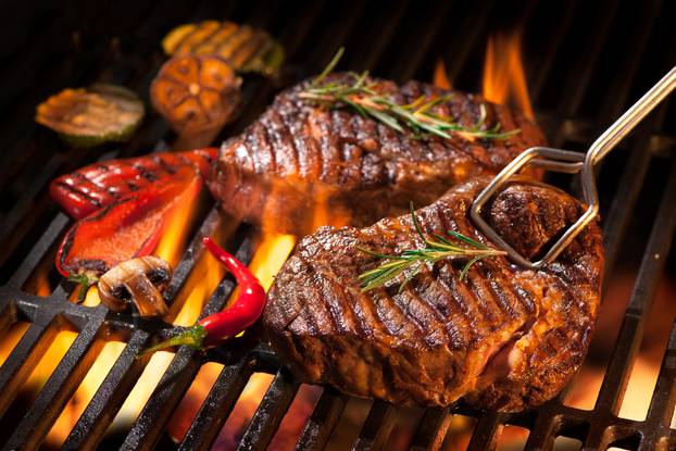 Beef steaks on the grill