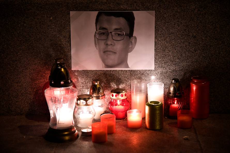 Candles in memory of murdered investigative journalist Jan Kuciak are seen in Trencin