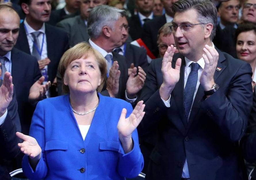 Croatia's Prime Minister Andrej Plenkovic, German Chancellor Angela Merkel and Manfred Weber of the European People's Party during EPP and the Croatian Democratic Union's campaign rally for the European Parliament elections in Zagreb