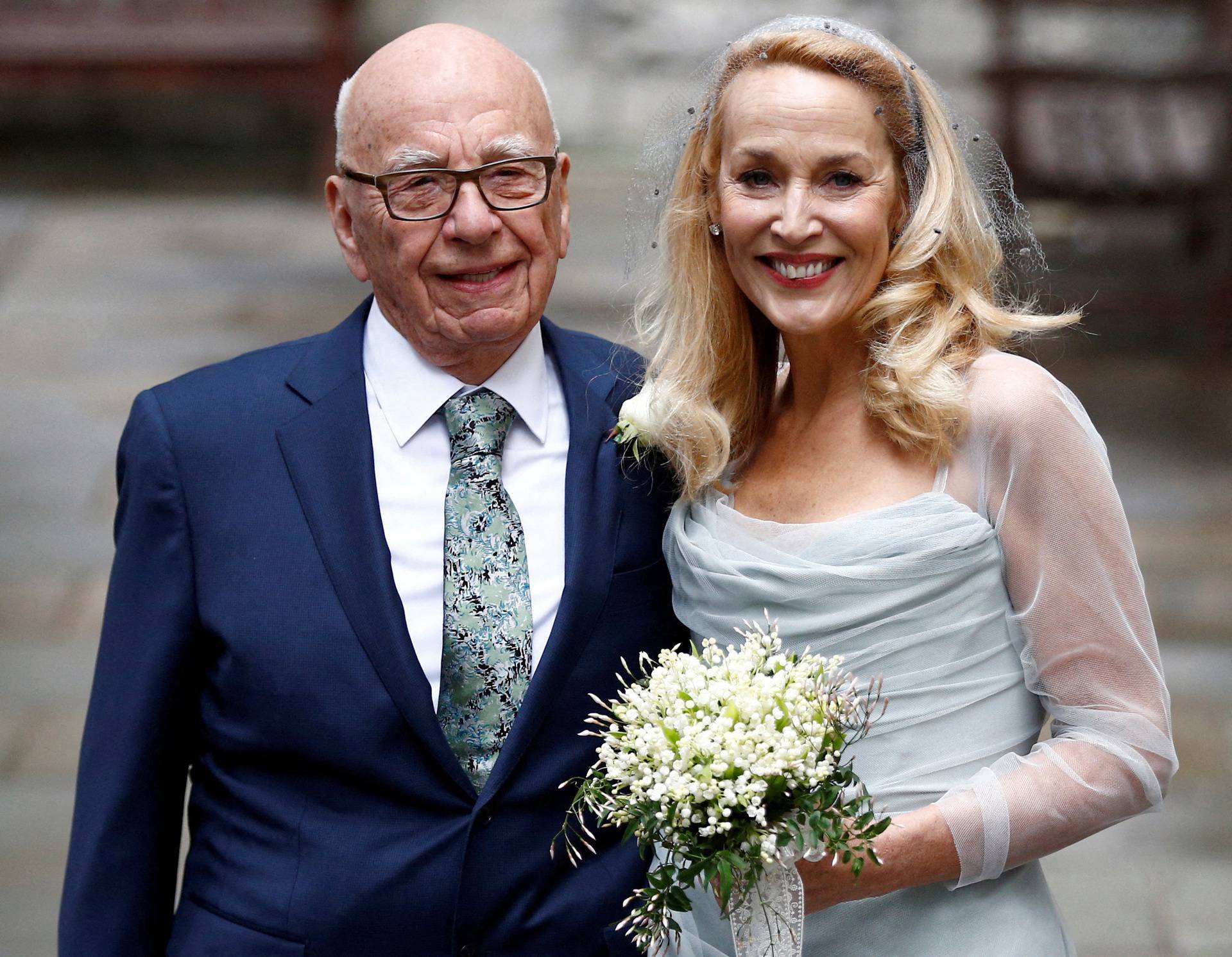 FILE PHOTO: Rupert Murdoch and Jerry Hall pose outside St Bride's church following a service to celebrate their wedding in London