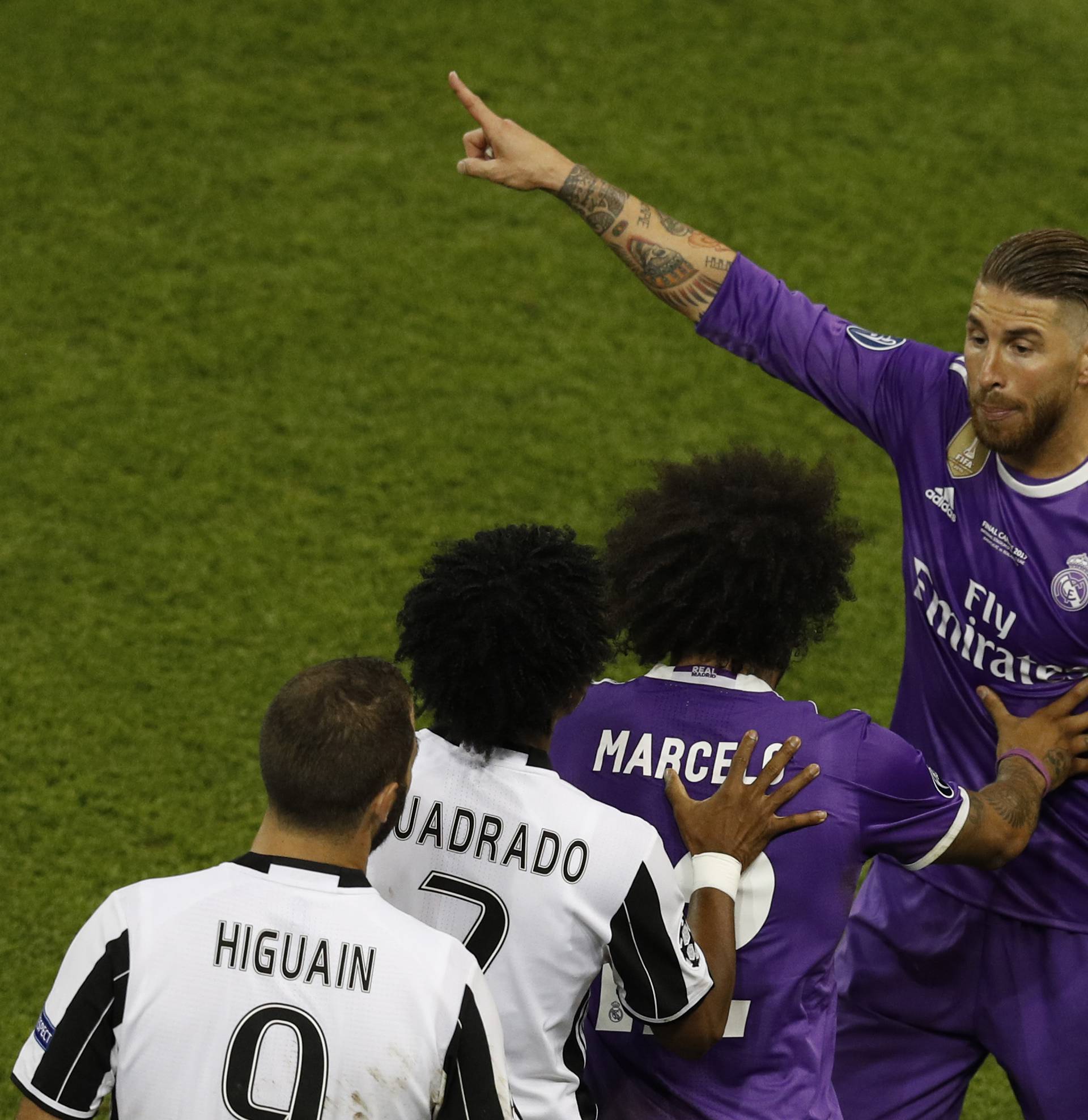 Real Madrid's Sergio Ramos gestures as Juventus' Juan Cuadrado is sent off