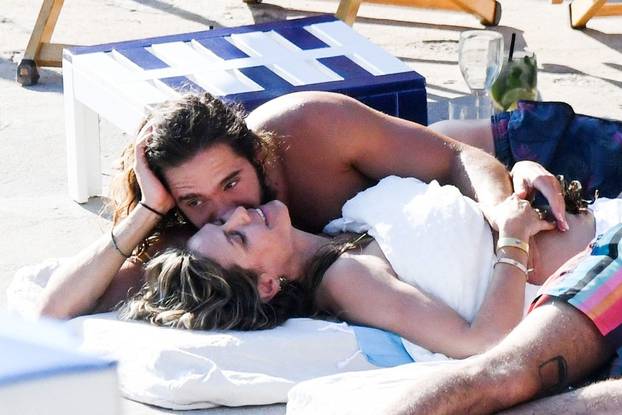 *EXCLUSIVE* *MUST CALL FOR PRICING* *STRICTLY NOT AVAILABLE FOR DAILY MAIL ONLINE USAGE* Newly married couple, the German Model Heidi Klum is spotted kissing with her musician husband Tom Kaulitz out in Capri.
