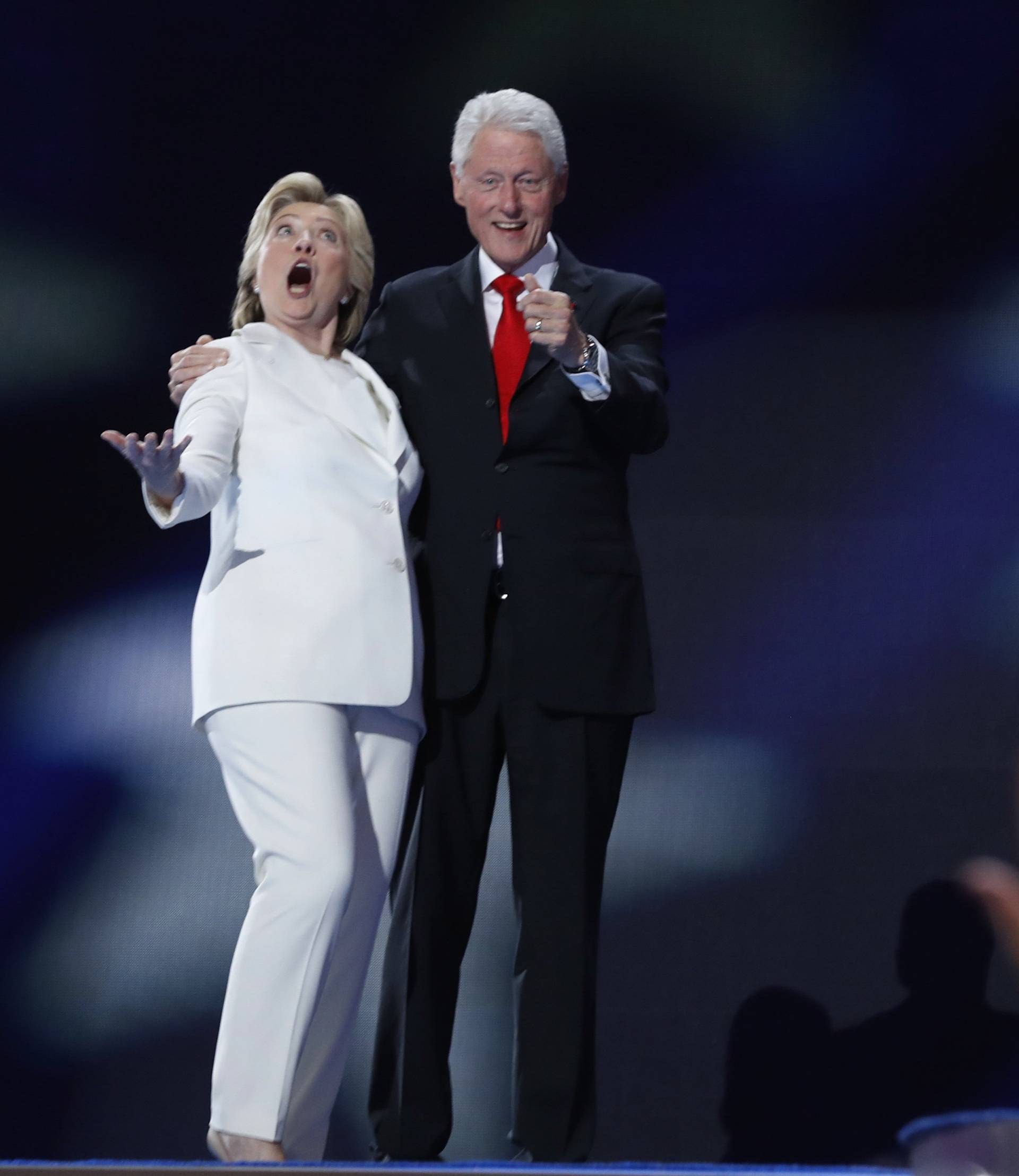 Democratic presidential nominee Hillary Clinton and her husband former president Bill Clinton react to the balloon drop after she accepted the nomination on the fourth and final night at the Democratic National Convention in Philadelphia