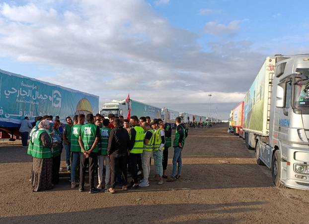 Groups carrying humanitarian aid for Palestinians wait for Rafah crossing to open