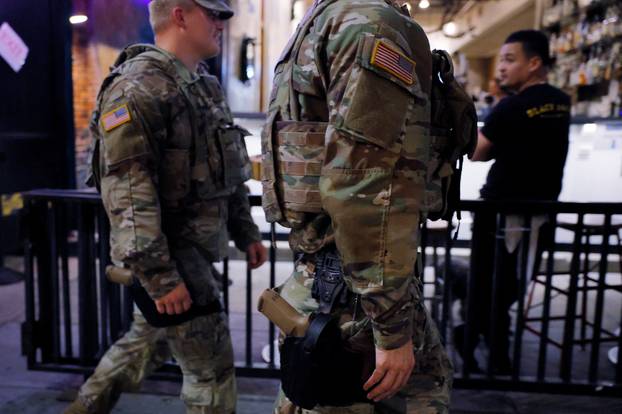 Members of the Ohio National Guard wear their sidearms while patrolling in Washington