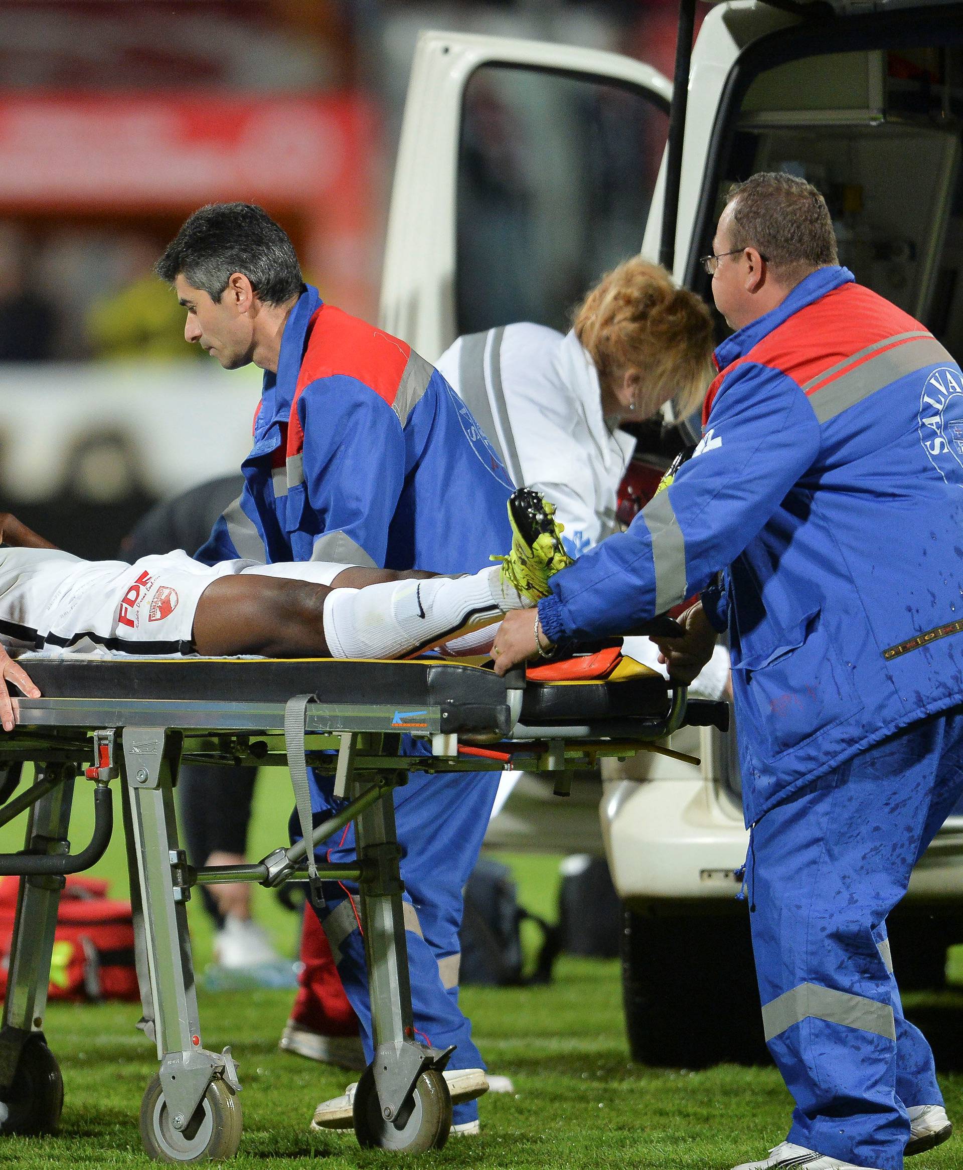 Dinamo Bucharest's Ekeng is transported to an ambulance after collapsing during a play-off match against Viitorul Constanta in Bucharest