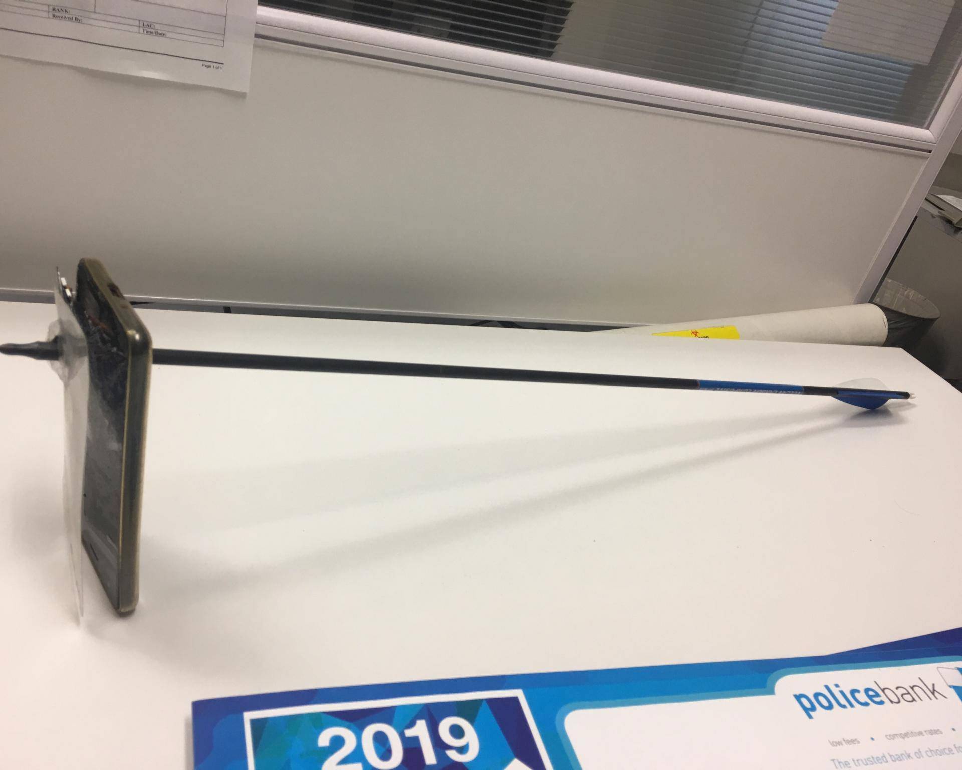 A picture shows an arrow that pierced a mobile telephone after accident in Nimbin