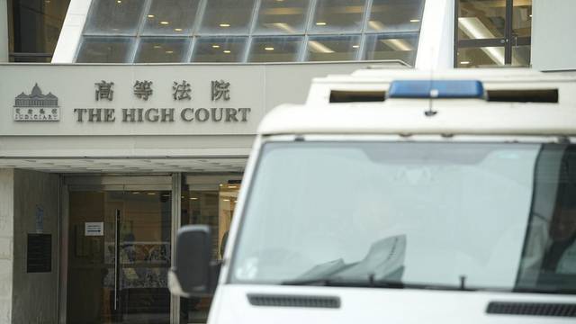 A police vehicle is pictured outside the High Court where a court hearing on property developer China Evergrande Group is held, in Hong Kong