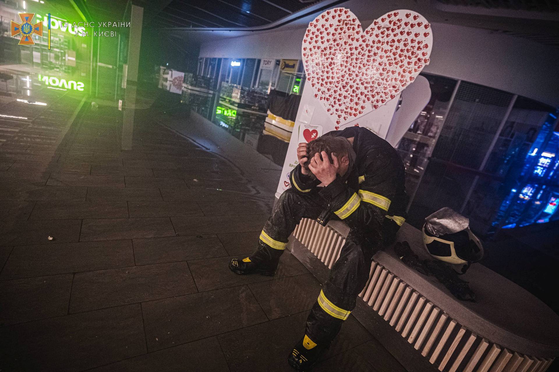 A rescuer reacts inside a shopping mall damaged by an airstrike in Kyiv