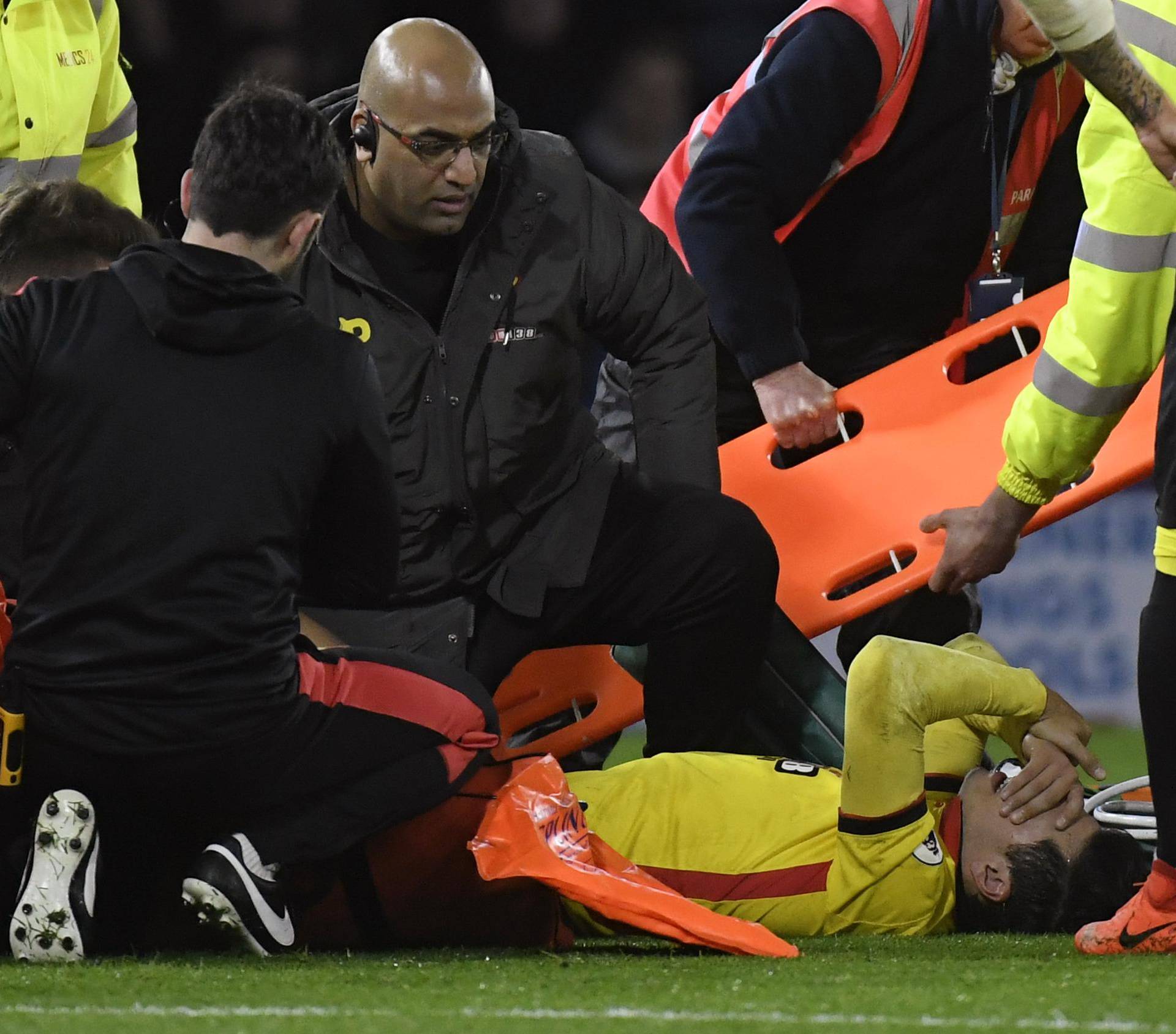 Watford's Mauro Zarate receives medical attention after sustaining an injury