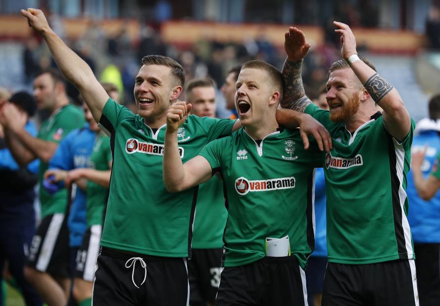 Lincoln's Alan Power, Terry Hawkridge and Jonathan Jack Muldoon celebrate after the match