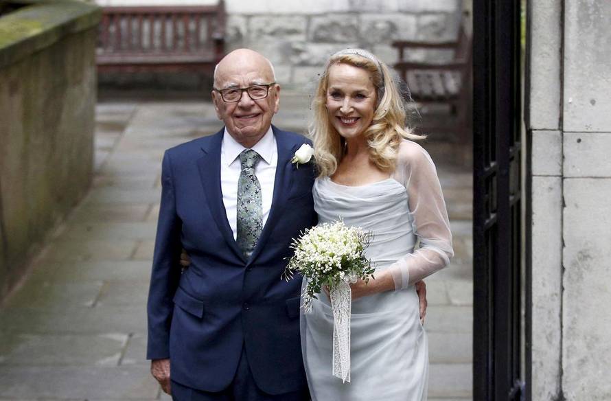 FILE PHOTO: Media Mogul Rupert Murdoch and former supermodel Jerry Hall pose for a photograph outside St Bride's church following a service to celebrate their wedding which took place on Friday, in London