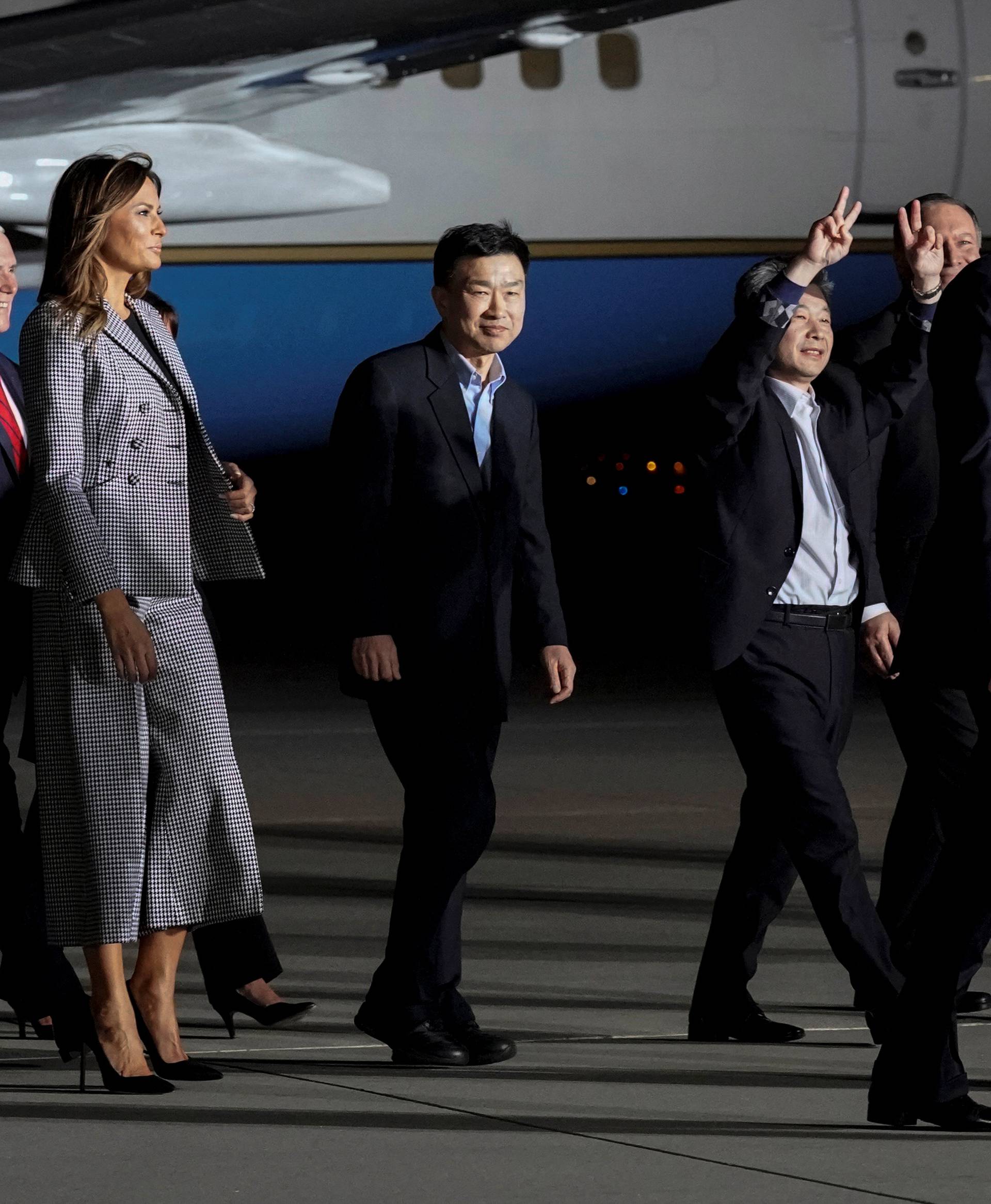 The three Americans released from detention in North Korea, Tony Kim, Kim Hak-song and Kim Dong-chul, walk next to U.S.President Donald Trump as they arrive at Joint Base Andrews