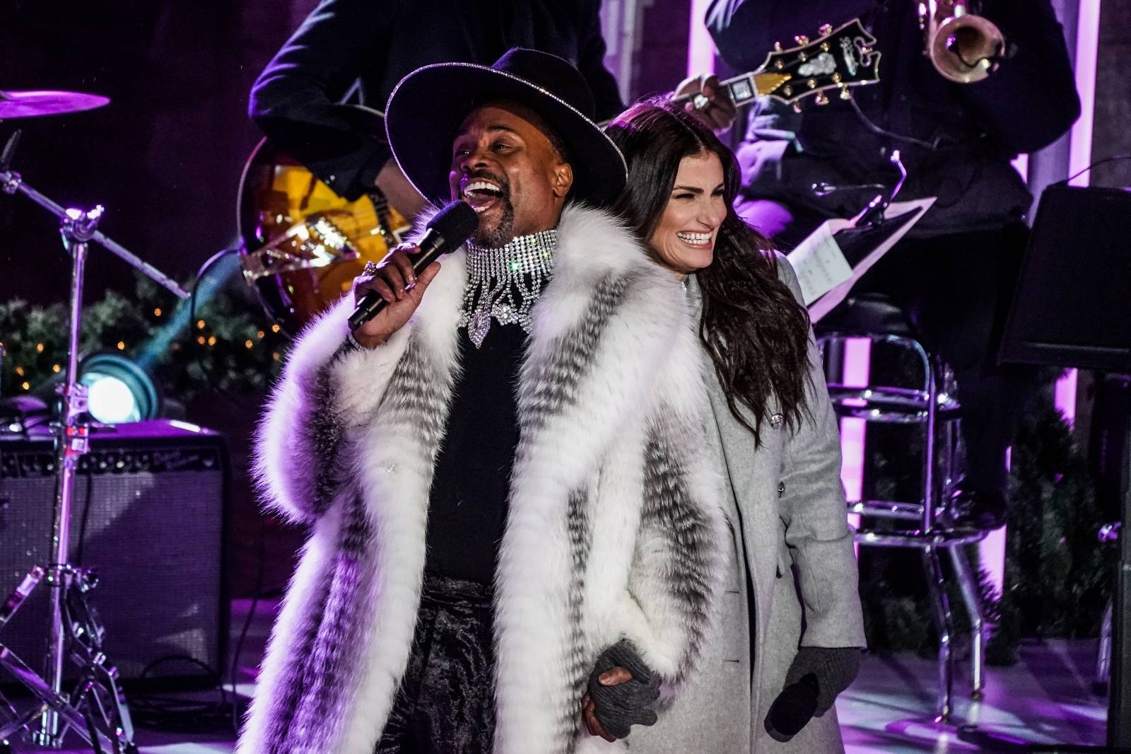 Billy Porter and Idina Menzel perform during the Christmas tree lighting show at Rockefeller Center in the Manhattan borough of New York City