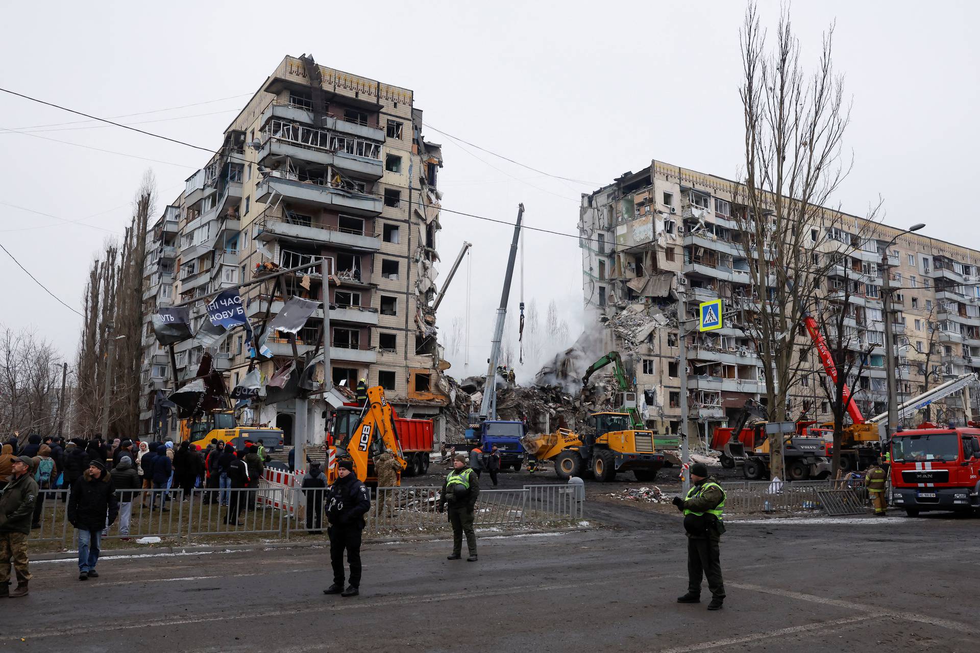 Aftermath of Dnipro apartment block destruction following missile strike