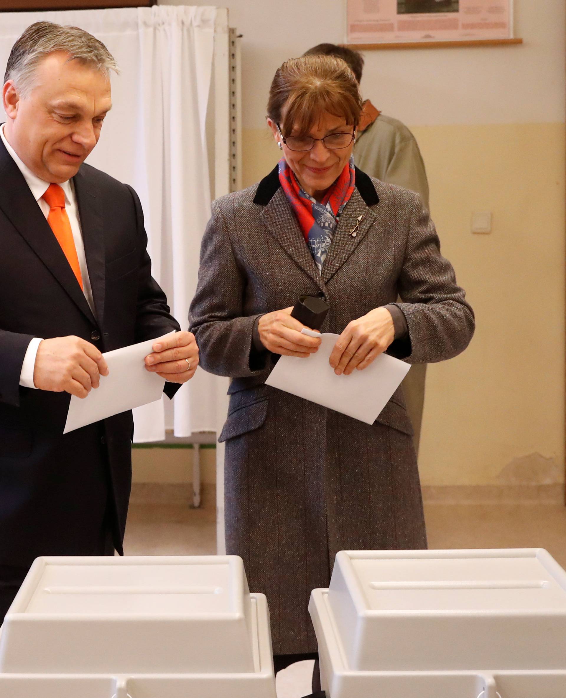 Current Hungarian Prime Minister Viktor Orban and his wife Aniko Levai vote during Hungarian parliamentary election in Budapest