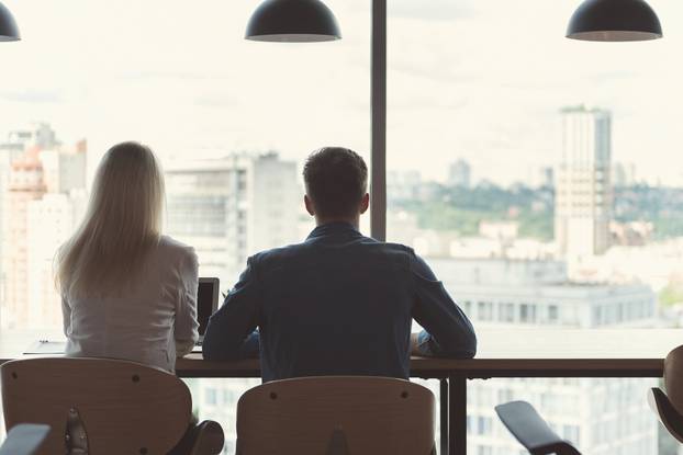 Youthful Lady and Guy Working on Project Together in Office