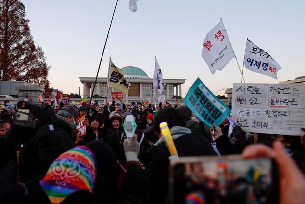 Rally calling for the impeachment of South Korean President Yoon Suk Yeol, who declared martial law, which was reversed hours later, in front of the National Assembly in Seoul