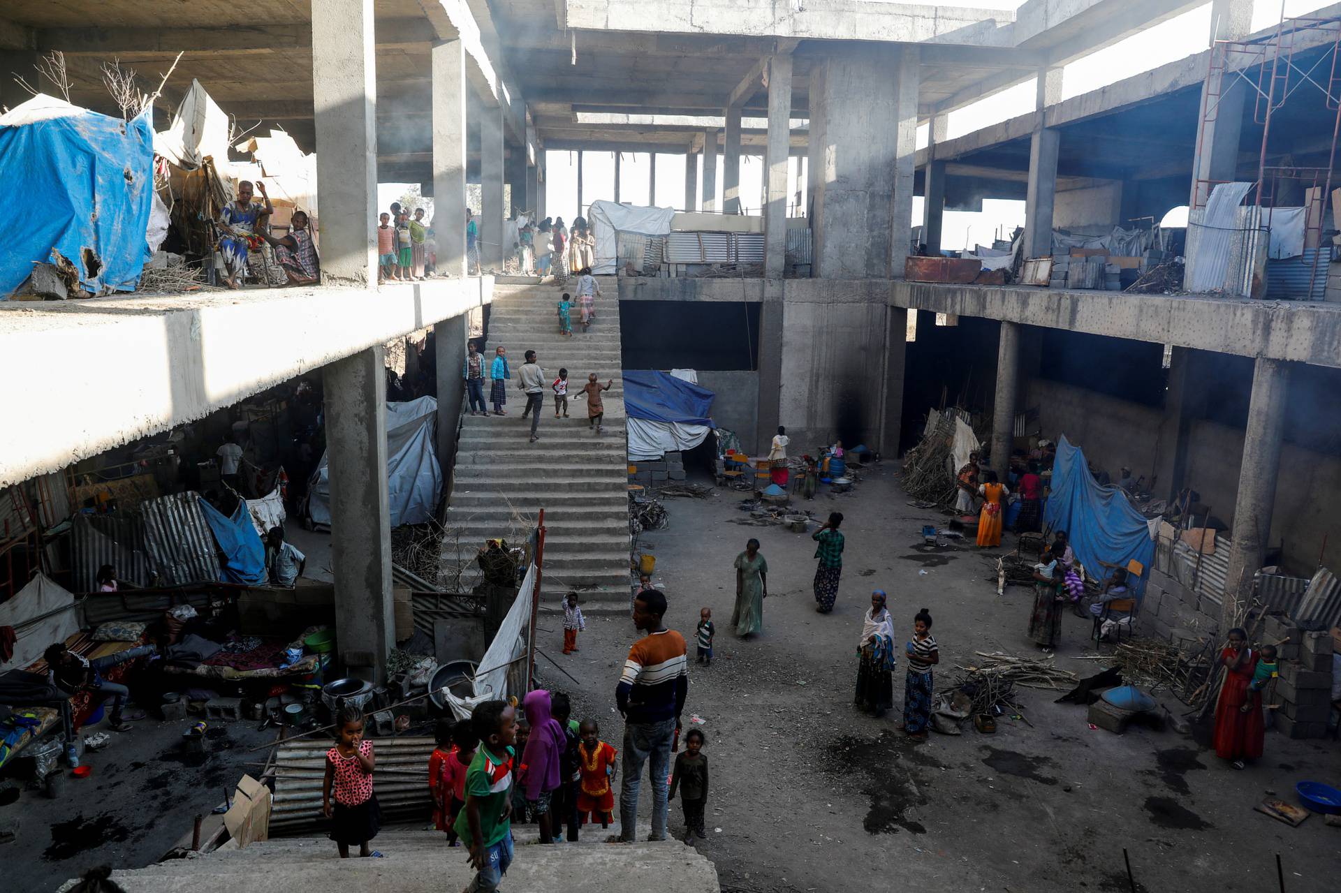 FILE PHOTO: Displaced people are seen inside a building under construction at the Shire campus of Aksum University