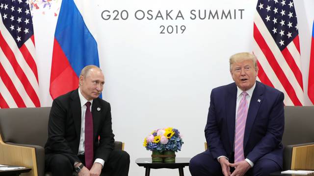 Russia's President Vladimir Putin and U.S. President Donald Trump attend a meeting on the sidelines of the G20 summit in Osaka
