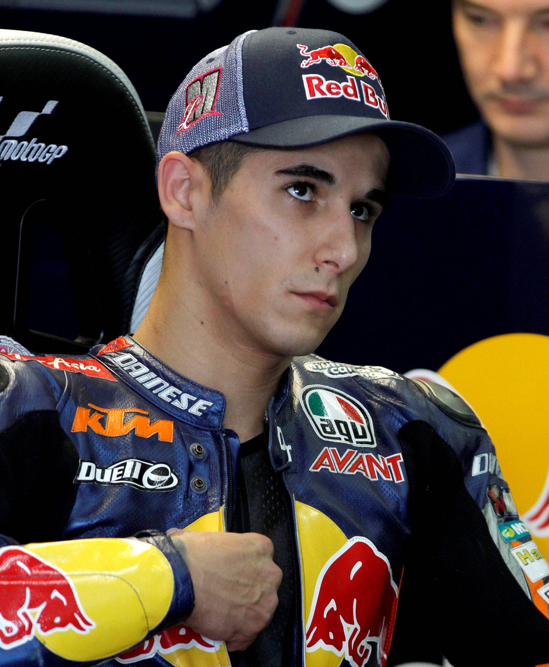 KTM Moto3 rider Luis Salom of Spain looks on before the first free practice session ahead the Valencia Motorcycle Grand Prix at the Ricardo Tormo racetrack in Cheste, near Valencia
