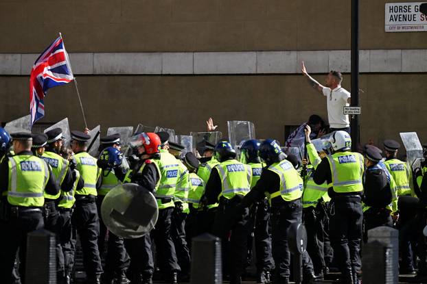 Anti-racism protesters gather to counter anti-immigration rally led by Tommy Robinson, in London