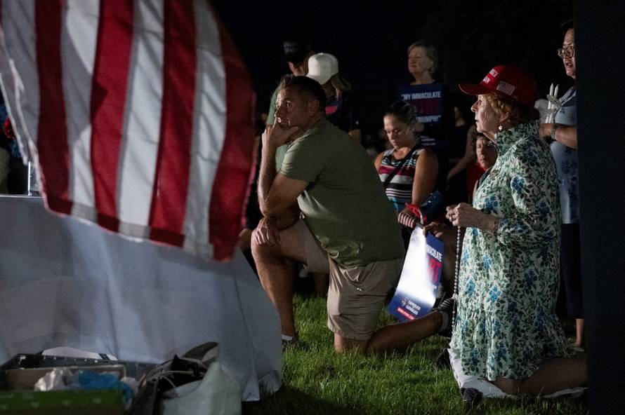 Catholics from across the Phoenix area gather to pray for Charlie Kirk, who was shot and killed in Utah, at Desert Horizon Park in Scottsdale