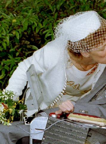 A kiss for scientist and theorist Stephen Hawking from his new bride Elaine Mason after their civil ..