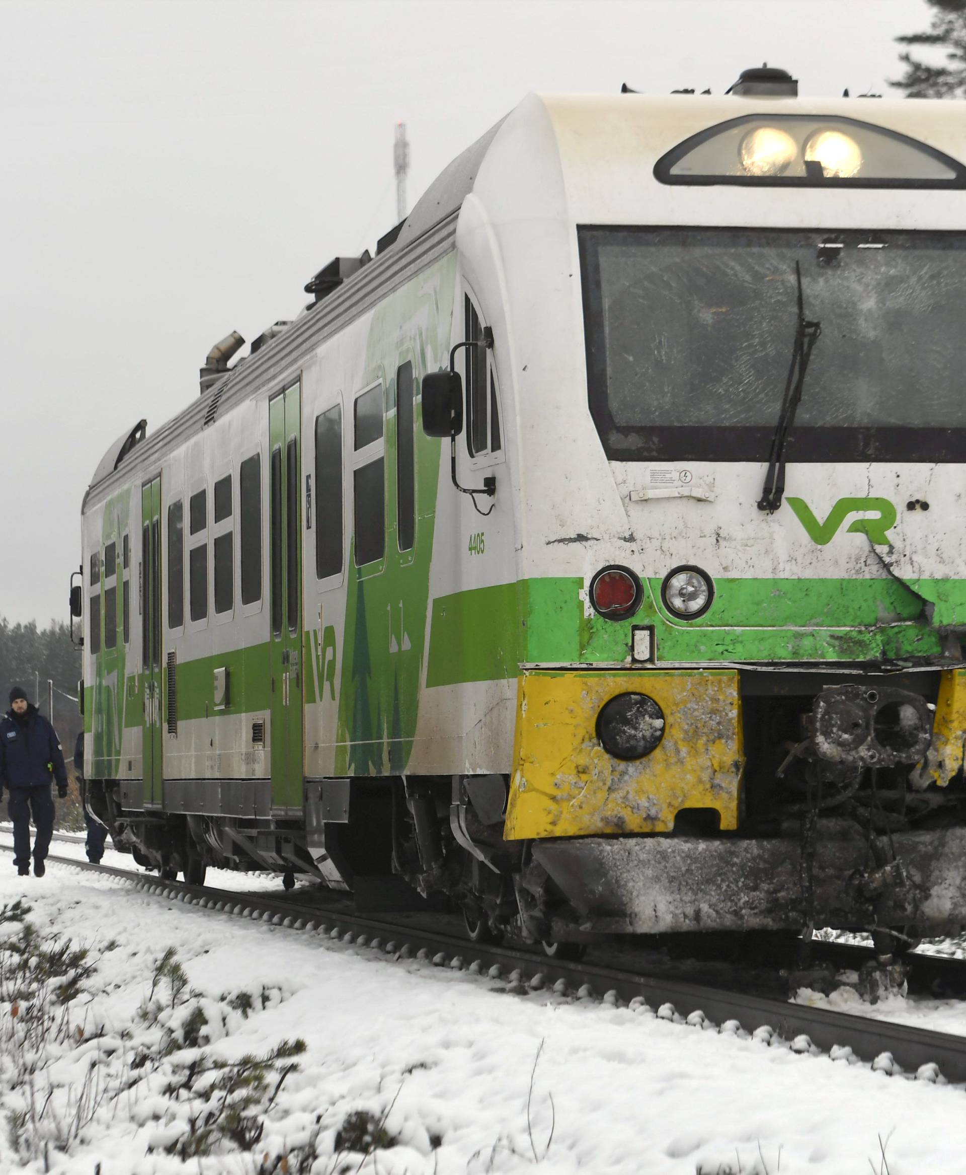 Passenger train near the railroad crossing is pictured after a crash in Raasepori