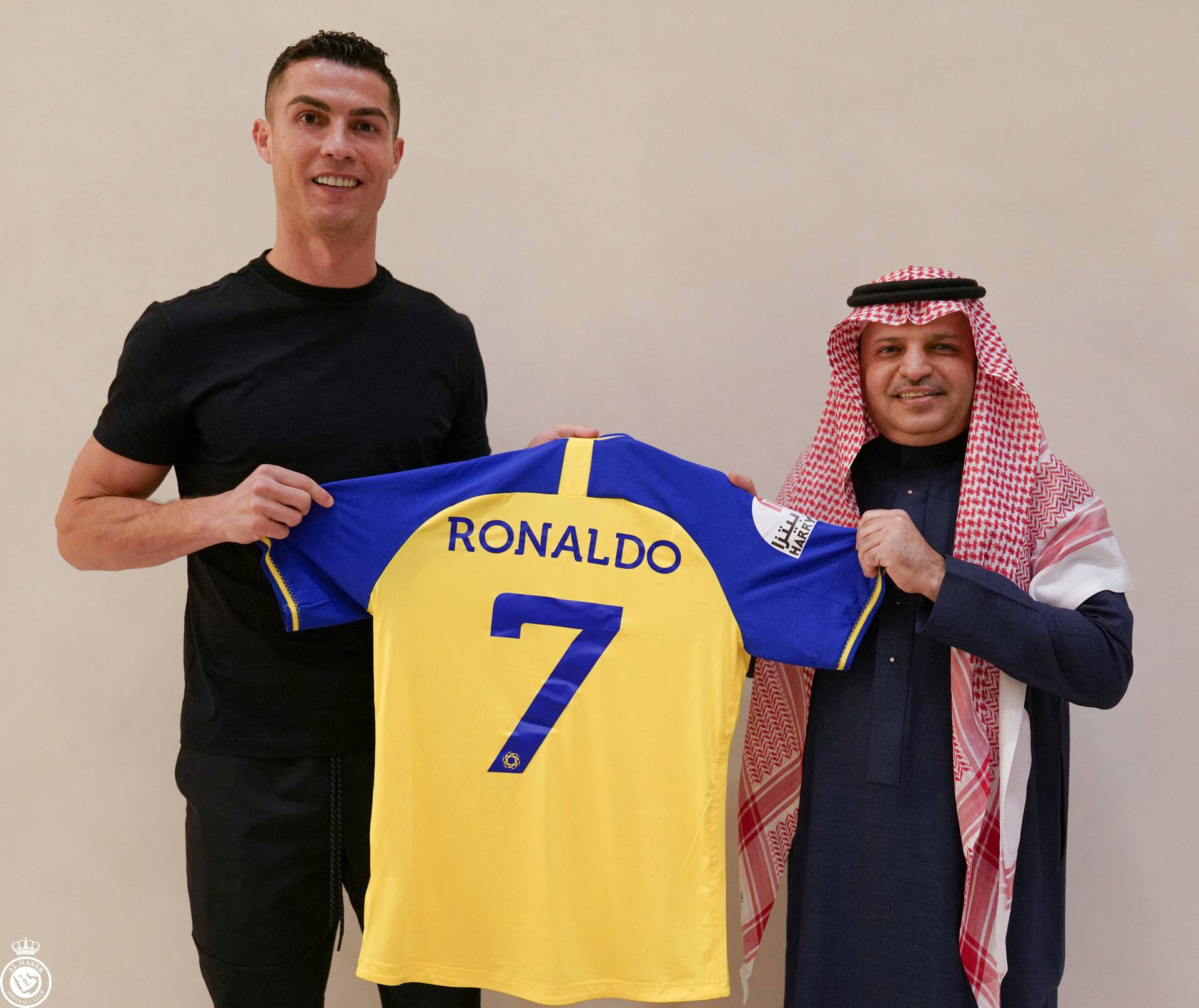 Portuguese soccer player Cristiano Ronaldo holds a shirt of the Saudi club Al-Nassr after signing the contract, in Madrid