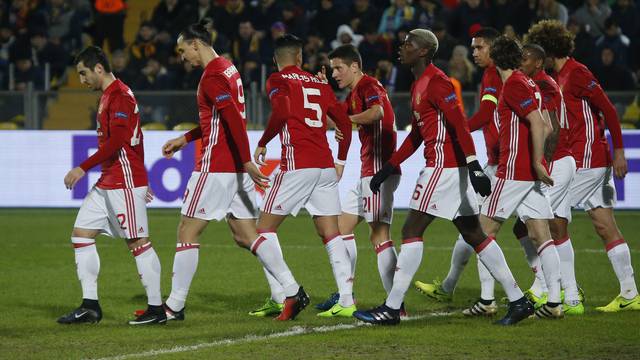 Manchester United's Henrikh Mkhitaryan celebrates scoring their first goal with team mates