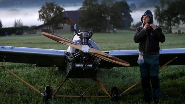 Aviator Frantisek Hadrava prepares before taking off with Vampira, an ultralight plane based on the U.S.-design of light planes called Mini-Max, near the village of Zdikov