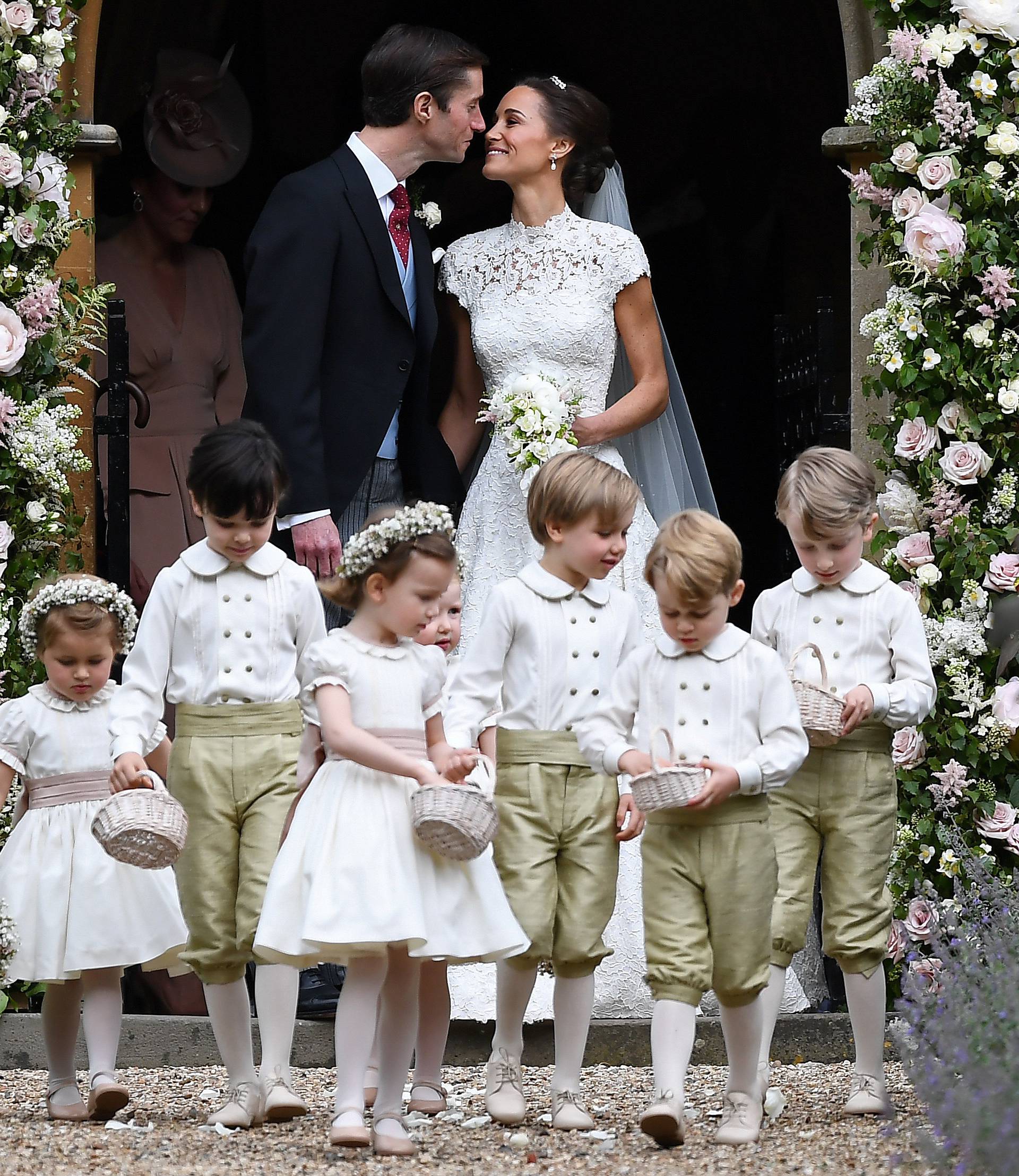 Pippa Middleton kisses her new husband James Matthews, following their wedding ceremony at St Mark's Church in Englefield