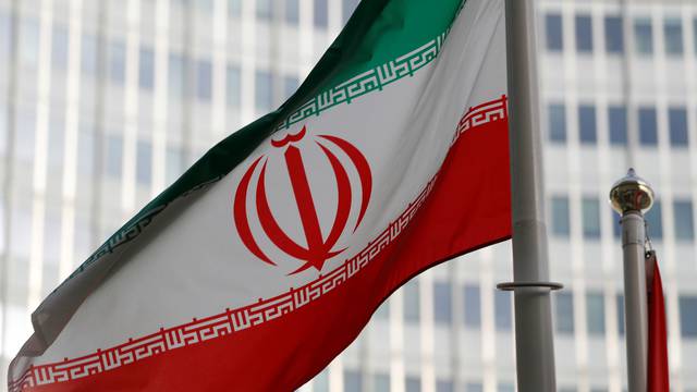 FILE PHOTO: The Iranian flag flutters in front the International Atomic Energy Agency (IAEA) headquarters in Vienna