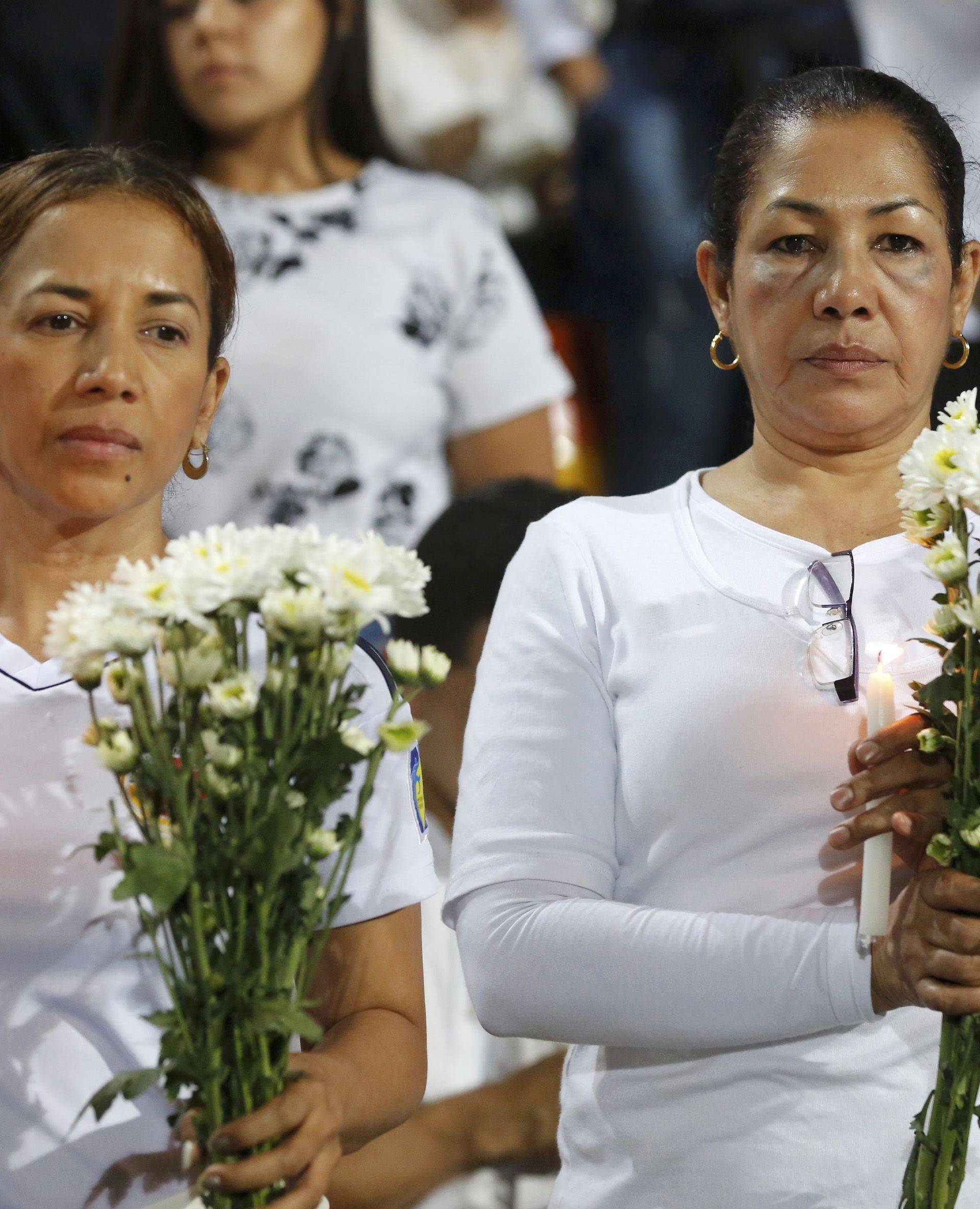 Fans of Atletico Nacional soccer club pay tribute to the players of Brazilian club Chapecoense killed in the recent airplane crash in Medellin