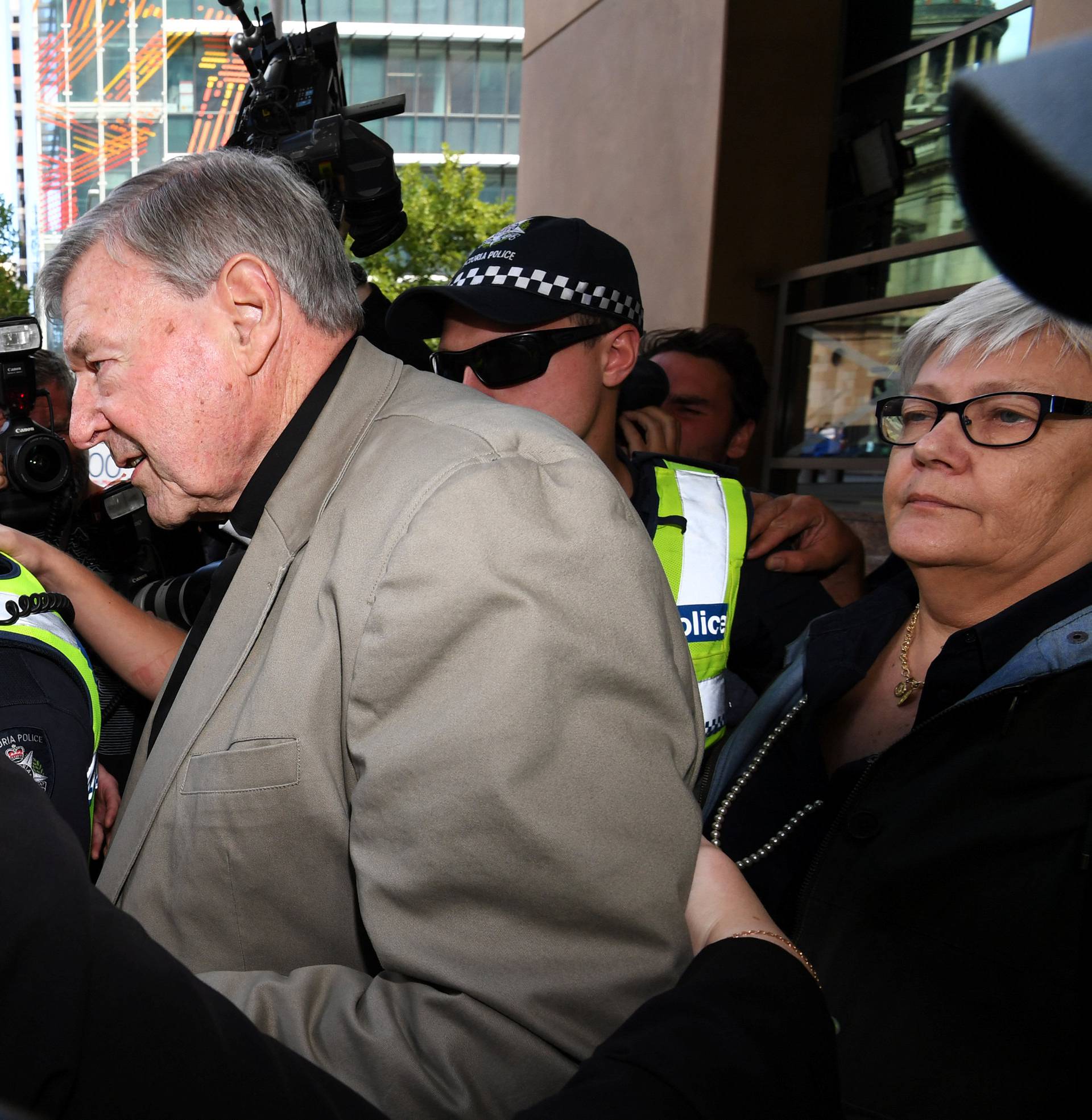 Cardinal George Pell departs the Melbourne Magistrates Court in Melbourne