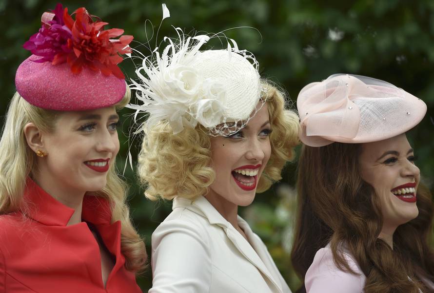 Britain Horse Racing Ladies Day Racegoers wear hats