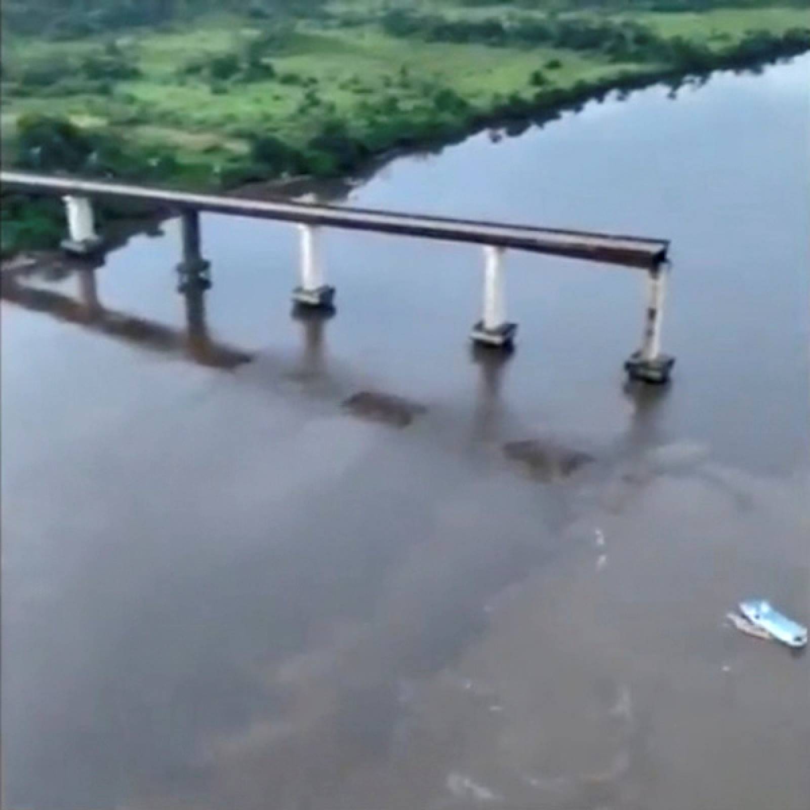 An aerial view showing a part of a collapsed bridge over the Moju River in Brazil's Para state