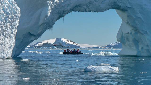 Large ice arch in iceberg in Antarctica