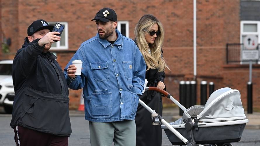 *EXCLUSIVE* WEB MUST CALL FOR PRICING  - Manchester City's hard man, the Croatian footballer Mateo Kovacic with his wife Izabel and his father Stipo are stopped in their tracks by a somewhat irate fan in Wilmslow, Cheshire.