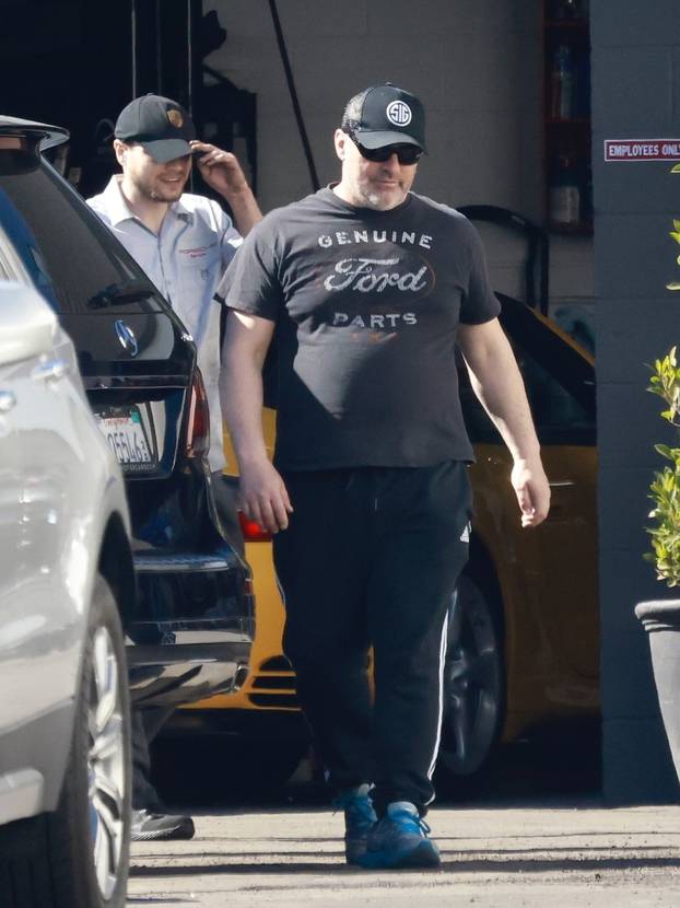 *EXCLUSIVE* Matt LeBlanc check out a car at a body shop with noticeably more weight on him