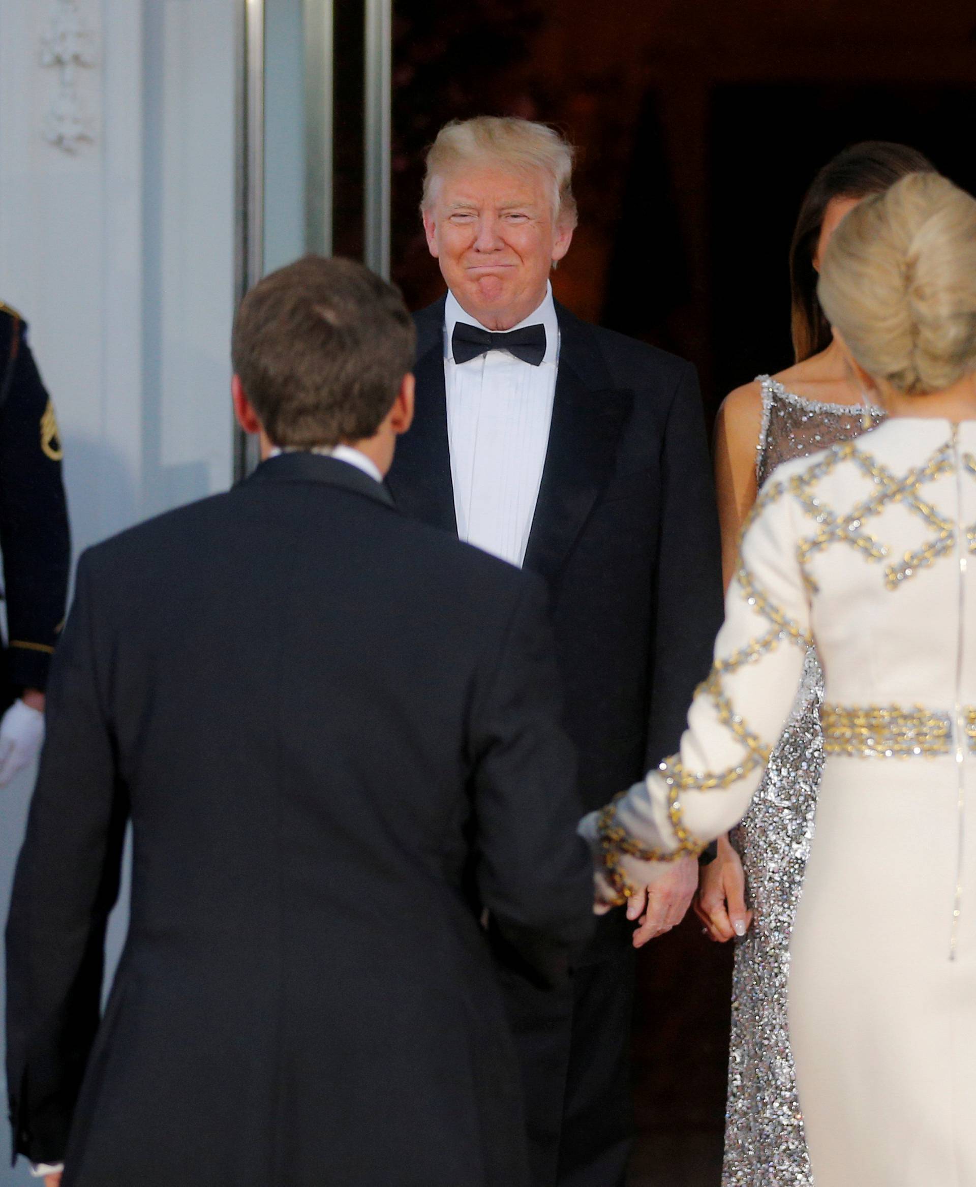 U.S. President Trump and first lady Melania welcome French President Macron and his wife for a State Dinner at the White House in Washington
