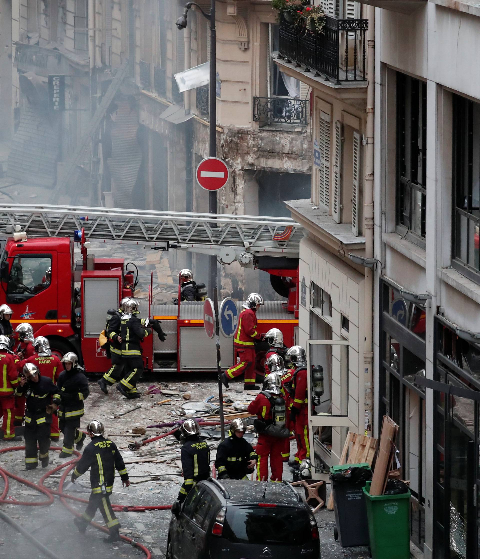 Firemen work at the site of an explosion in a bakery shop in the 9th District in Paris