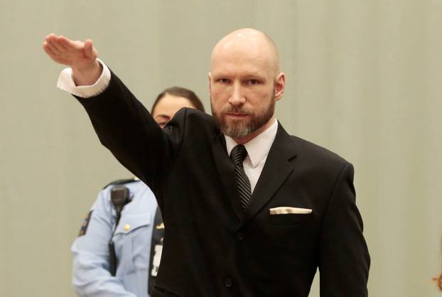 Anders Behring Breivik raises his right hand during the appeal case in Borgarting Court of Appeal at Telemark prison in Skien