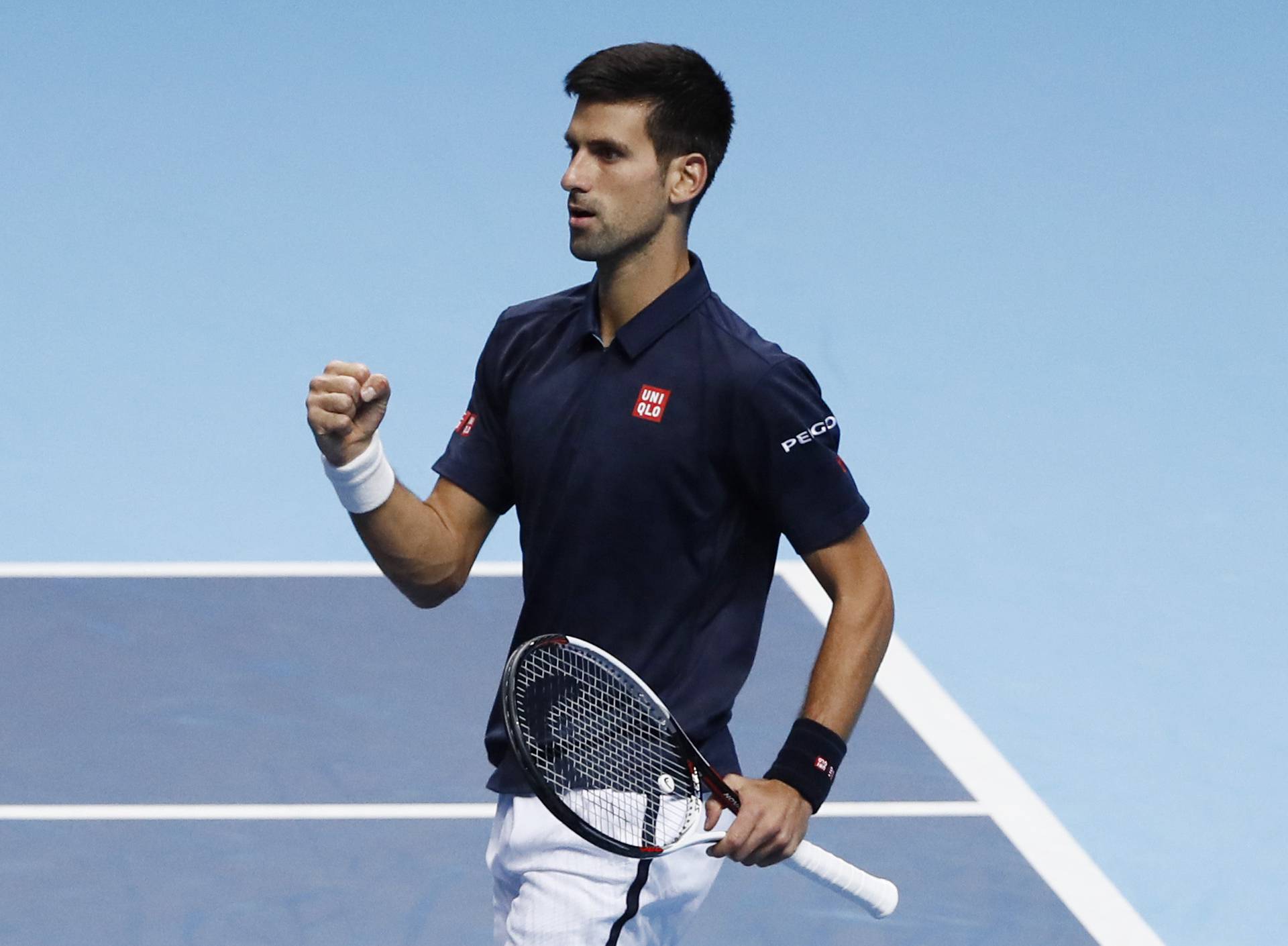 Serbia's Novak Djokovic celebrates during his round robin match with Canada's Milos Raonic