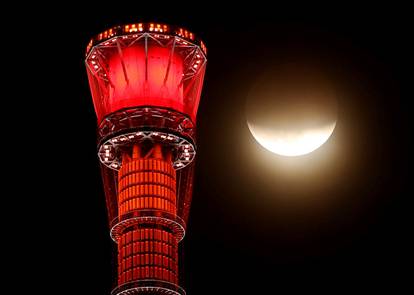 Moon next to Tokyo Skytree during a partial lunar eclipse in Tokyo