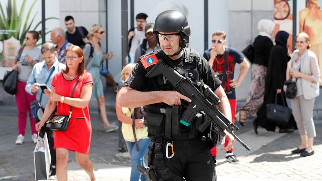 A member of the special police forces gestures in Liege