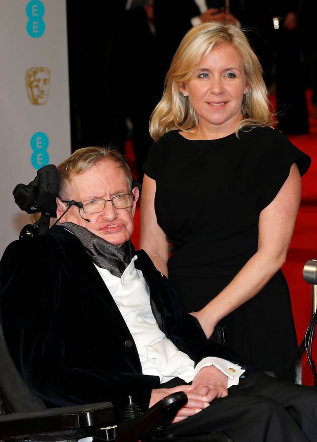 FILE PHOTO: Theoretical physicist Stephen Hawking and his daughter Lucy arrive at the British Academy of Film and Arts (BAFTA) awards ceremony at the Royal Opera House in London