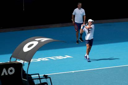 Novak Djokovic practices on court ahead of 2022 Australian Open