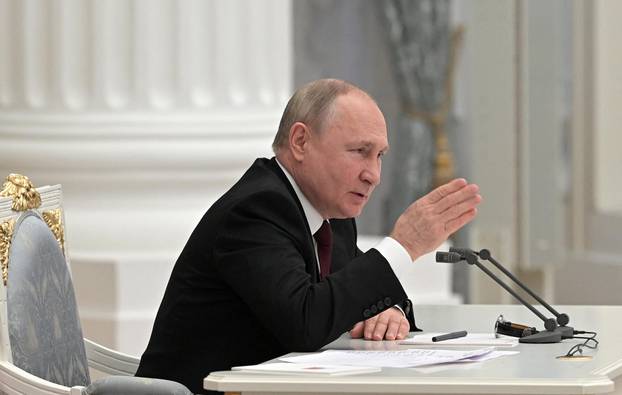 Russian President Putin chairs a meeting with members of the Security Council in Moscow